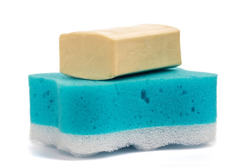 Soap and blue washcloth on a white background