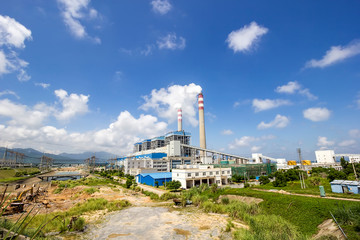 Coal-fired power plants under the blue sky white clouds