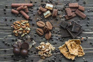 Still life.Caciotta cheese and big blue grapes. Close-up, dark background.