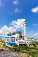 Coal-fired power plants under the blue sky white clouds