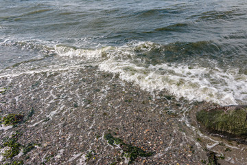 Overhead view of beach waves and foam v6