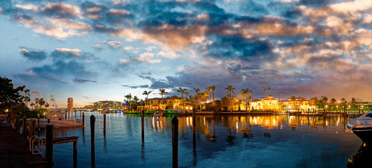 Fototapeta na wymiar Lake Boca Raton and city skyline with reflections at sunset, panoramic view