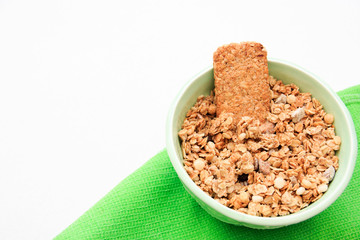 crispy muesli dry Breakfast in a bowl isolated on white background selective focus, top view