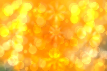 A festive abstract golden yellow gradient background texture with glitter defocused sparkle bokeh circles. Card concept for Happy New Year, party invitation, valentine or other holidays.