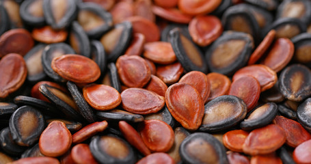 Stack of mix of black and red melon seed for lunar new year snack