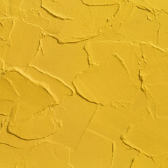 Fototapeta na wymiar Yellow plaster, acrylic surface painting, bright colorful background