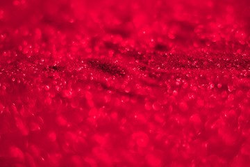 red bright metall sand made of glitters - festival concept with bokeh texture - cute abstract photo background
