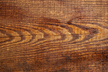 Fototapeta na wymiar fresh lacquer is applied on a wooden surface, background texture