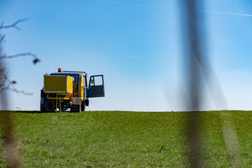 Fototapeta na wymiar a truck on a green meadow