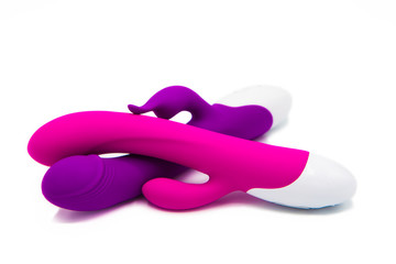 Sex toys. Vibrators purple and pink isolated on white background
