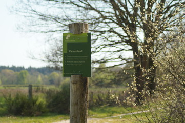 wooden sign in the forest Pannenhoef Sprundel in the Netherlands