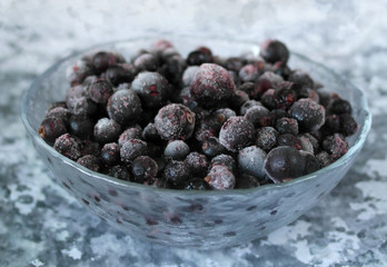 frozen currants in a transparent plate