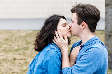 Young pretty couple - boy and girl spend time together. A romantic meeting of two young people