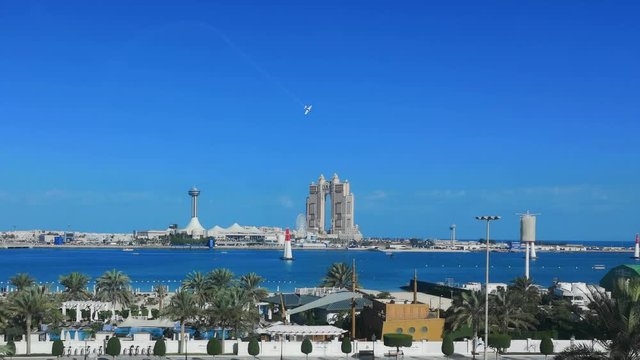 Airplane race show in Abu Dhabi corniche street - Abu Dhabi city famous landmarks: Marina Mall, Marina eye wheel, Fairmont Marina