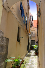 Fototapeta na wymiar Typical Italian lane with clothes drying aloft