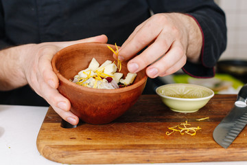 Chef cooking salad. Kitchen. Hands. Cook. Raw