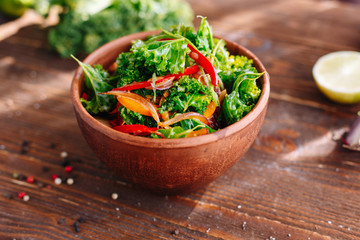 Cabbage salad with vegetables. Healthy food. Organic. Vitamin. Salat. Kitchen. Wooden table. Ingridients.