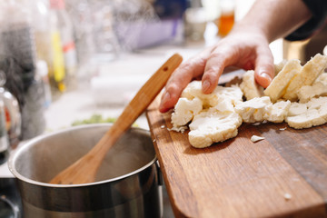 Cooking raw cauliflower. Boiled. Chef hands. Kitchen. Cuisine. Homemade.