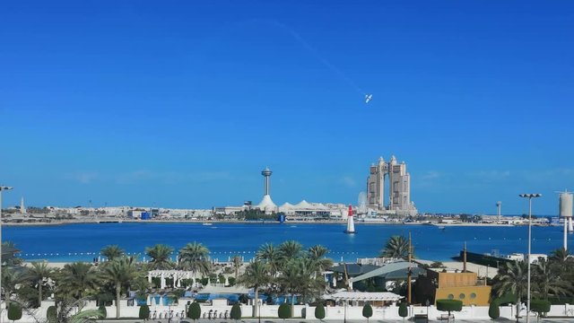 Airplane race show in Abu Dhabi corniche street - Abu Dhabi city famous landmarks: Marina Mall, Marina eye wheel, Fairmont Marina