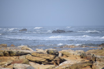 Fototapeta na wymiar Rocks in the sea at Crimdon