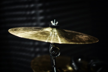 Gold plates from the drum set in the recording Studio. Professional drummers play recording