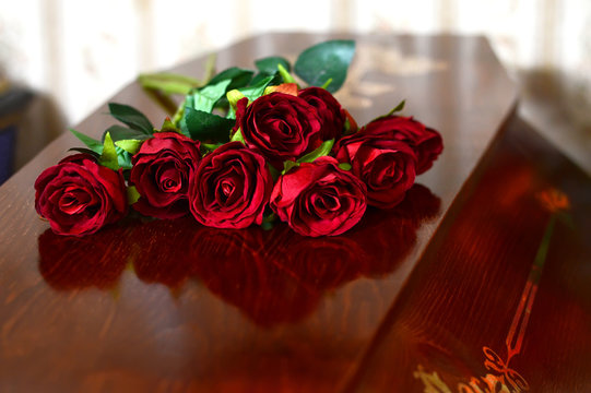 Coffin With Flowers On The Lid. The Burial Of Man, The Sorrow Of The Dead. The Funeral.