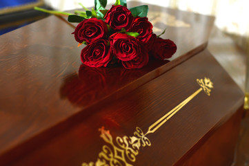 Coffin with flowers on the lid. The burial of man, the sorrow of the dead. Ceremony, ponihida.