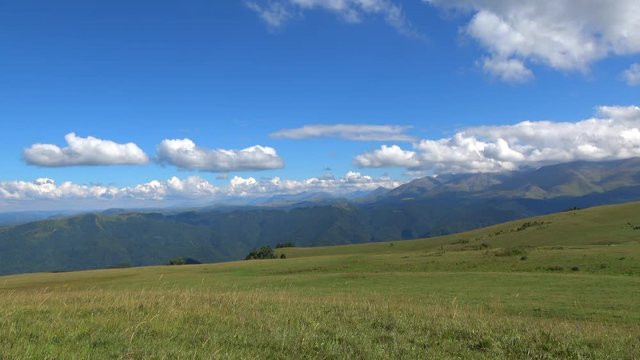 View mountains scenes in national park Dombai, Caucasus, Russia, Europe. Summer landscape, sunshine weather, blue sky and sunny day