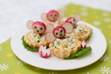 children's food, funny tartlets in the form of animals. Children's menu on a green background