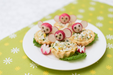 children's food, funny tartlets in the form of animals. Children's menu on a green background