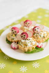 children's food, funny tartlets in the form of animals. Children's menu on a green background