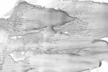Grunge white ink texture with abstract washes and paint stains on the white paper background.