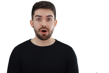 Young man cheerfully surprised looking at camera with his mouth open - whit space for caption or text - white background