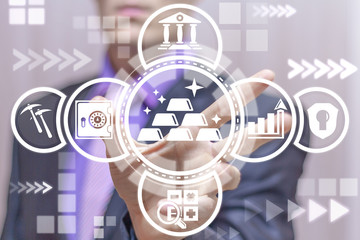 Man uses on a virtual screen of the future and touches the icon: golden bars stack. Gold Bar Wealth. Golden Assets and Stocks.