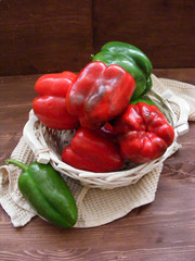 Vegetables background : fresh bell pepper on wooden table vertical photo