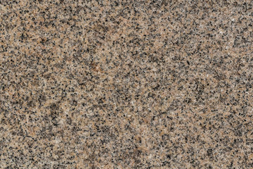 A beautiful texture of natural gray and yellow granite stone surface in the photo