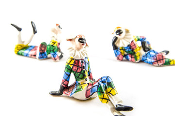Obraz premium Harlequin statuettes looking around