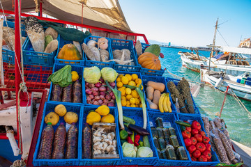 Vegetables at a market stall on a boat in Aegina port in Greece