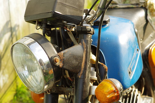 Close up of old motorbike.