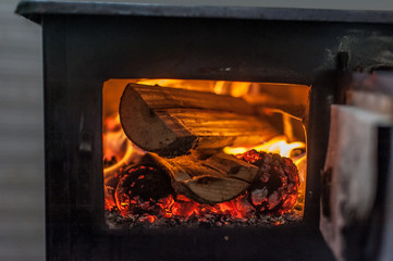 Wood stove with fire burning inside