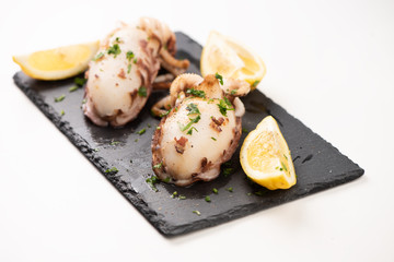 Delicious BBQ cuttle fish on a stone dish