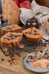 Cake with cocoa and chocolate on a wooden table. Sweet homemade pastries for breakfast. Rustic style photo.