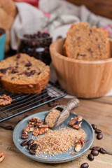 Cake with cocoa and chocolate on a wooden table. Sweet homemade pastries for breakfast. Rustic style photo.