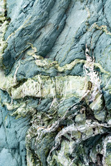 Background with green mineral rock close up, gemstone texture, olivine, amazonite, amphibolite