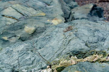 Background with green mineral rock close up, gemstone texture, olivine, amazonite, amphibolite