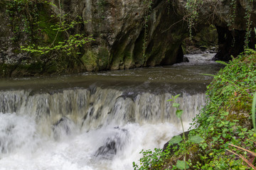 River getting out from a cave