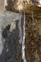Water falling from the natural spring fountain