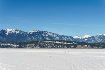 early spring landscape of frozen Windermere Lake Regional District of East Kootenay Canada.