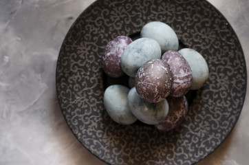 Easter eggs on a beautiful black plate