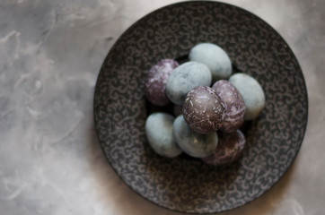Easter eggs on a beautiful black plate